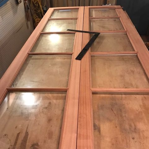Pair of mahogany French doors in the shop before finishing