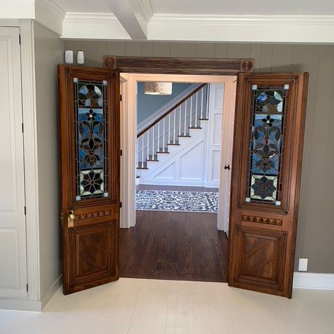 Pair of stained-glass interior doors opening to a foyer
