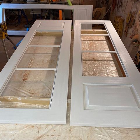 Custom French doors on sawhorses in the shop