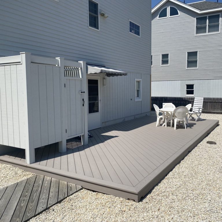 Custom deck with outdoor shower by Ziegler Builders