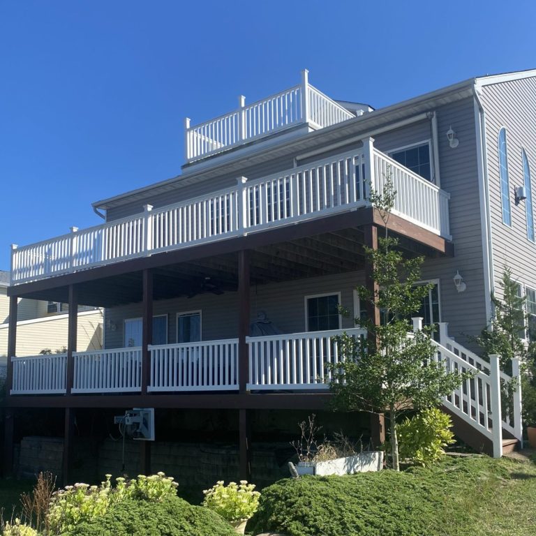 Custom 3 tiered deck on the water by Ziegler Builders